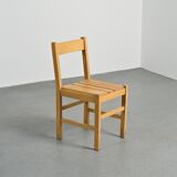 Set of six solid pine chairs by Maison Regain.
