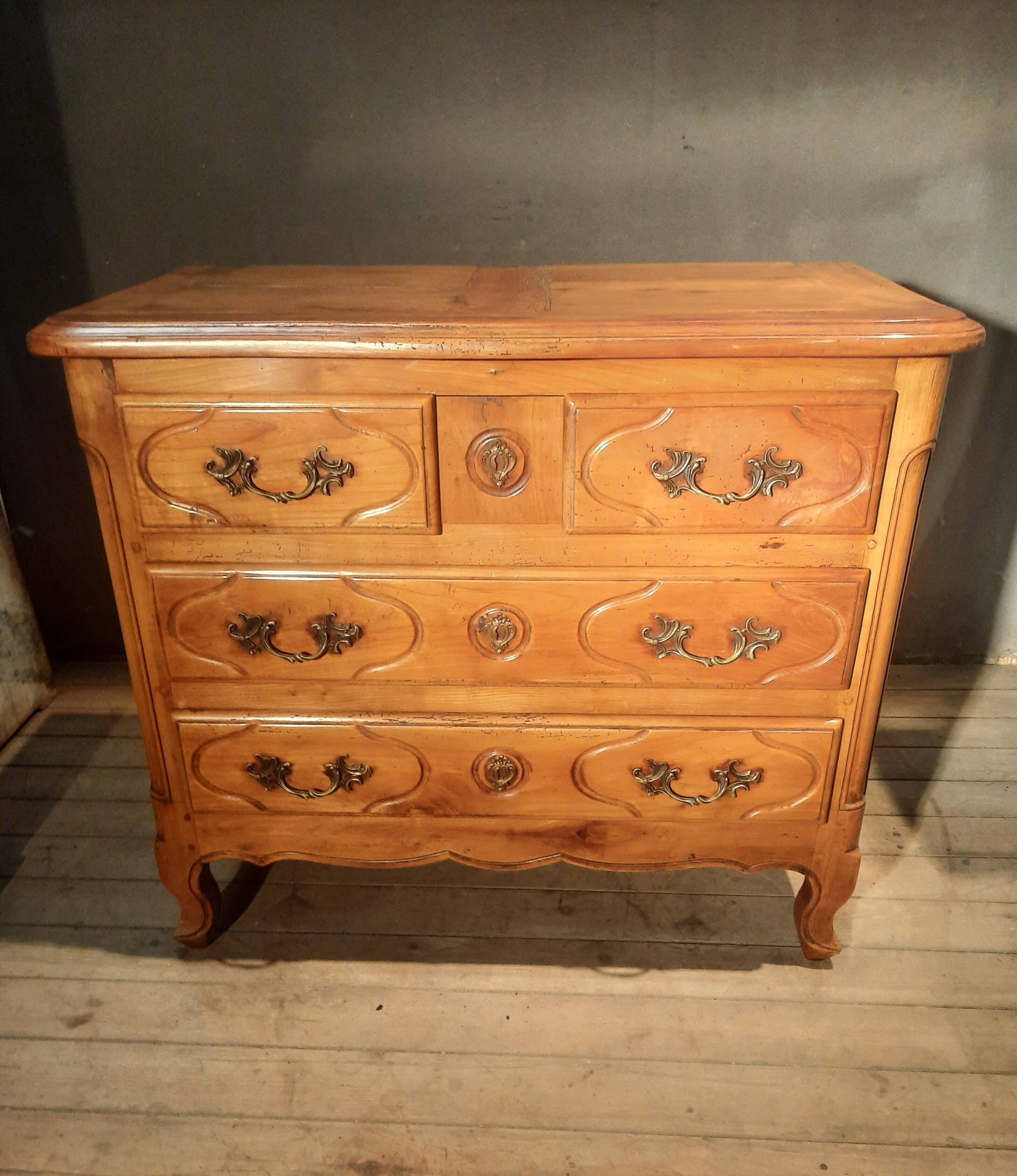 Louis XIV style commode in solid cherry wood.