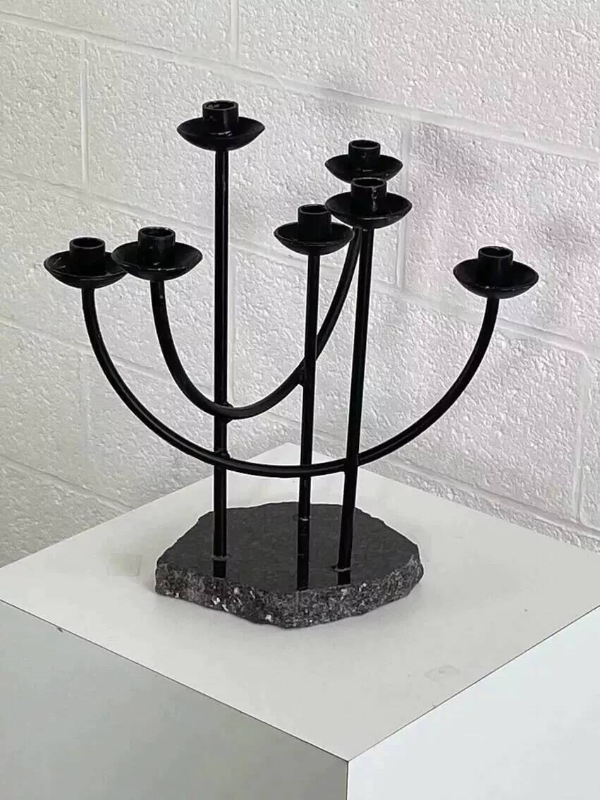 Metal candle holder and black quartz base