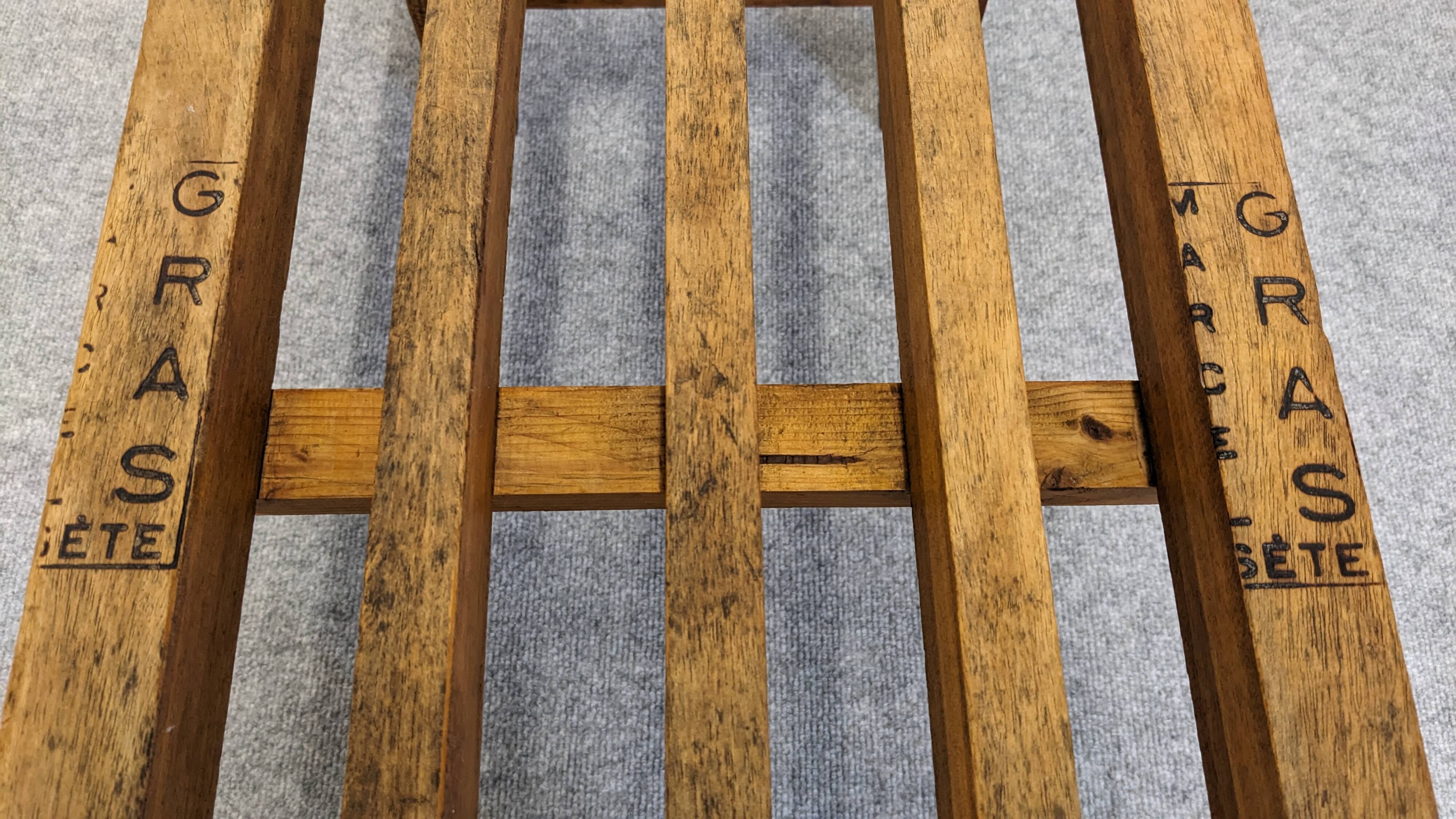 Wooden slatted display bench or support, France circa 1960.