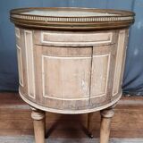 Round bedside table painted in trompe l'oeil