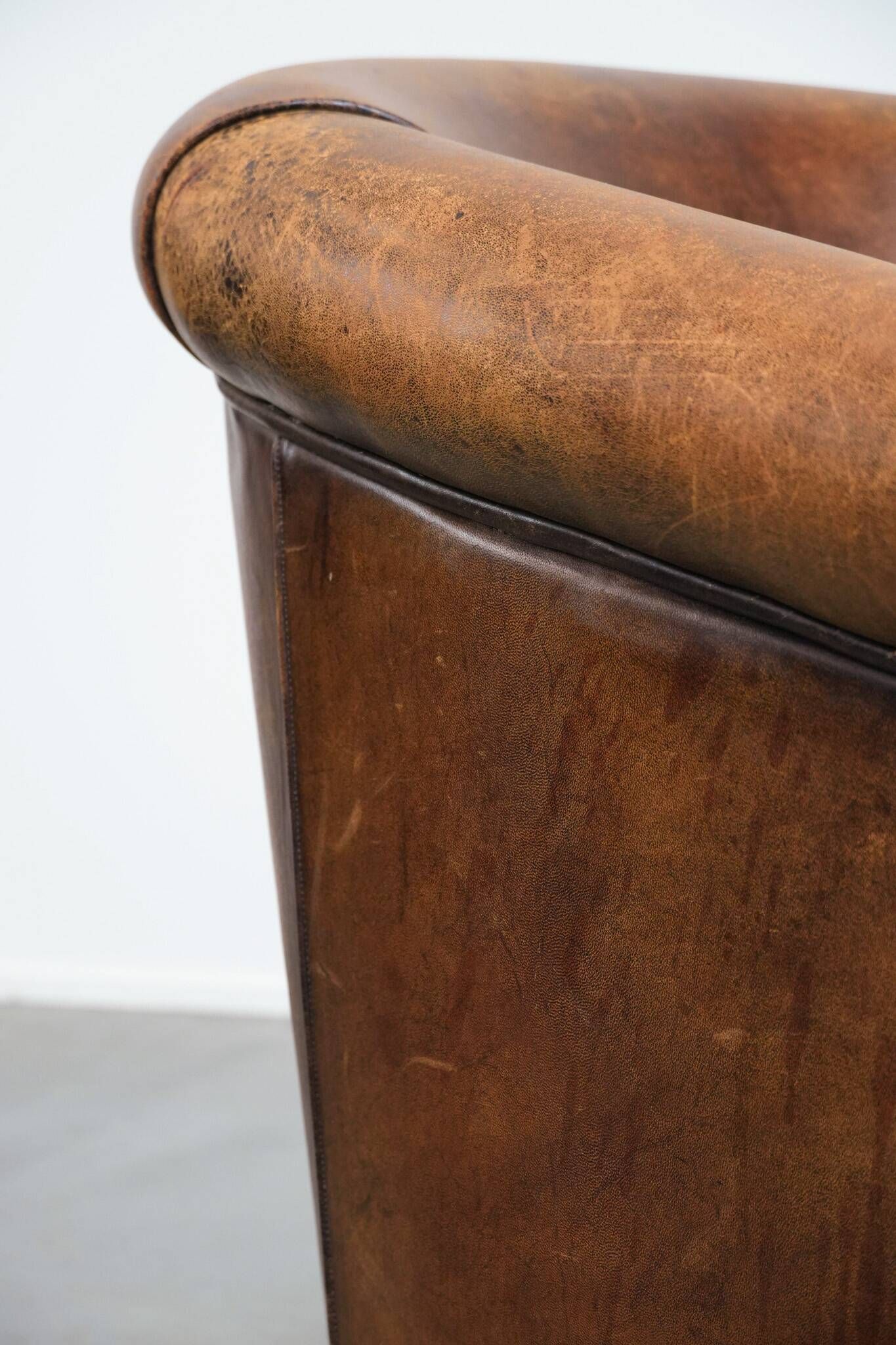 Vintage club chair in sheepskin leather with a characterful look