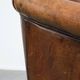Vintage club chair in sheepskin leather with a characterful look