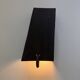 Pair of black stoneware graphic wall lights with handmade ring.