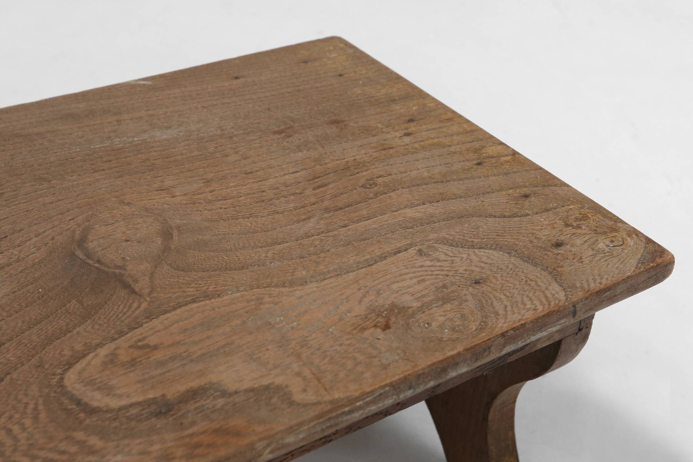Small rustic wooden stool with curved base, France ca. 1900