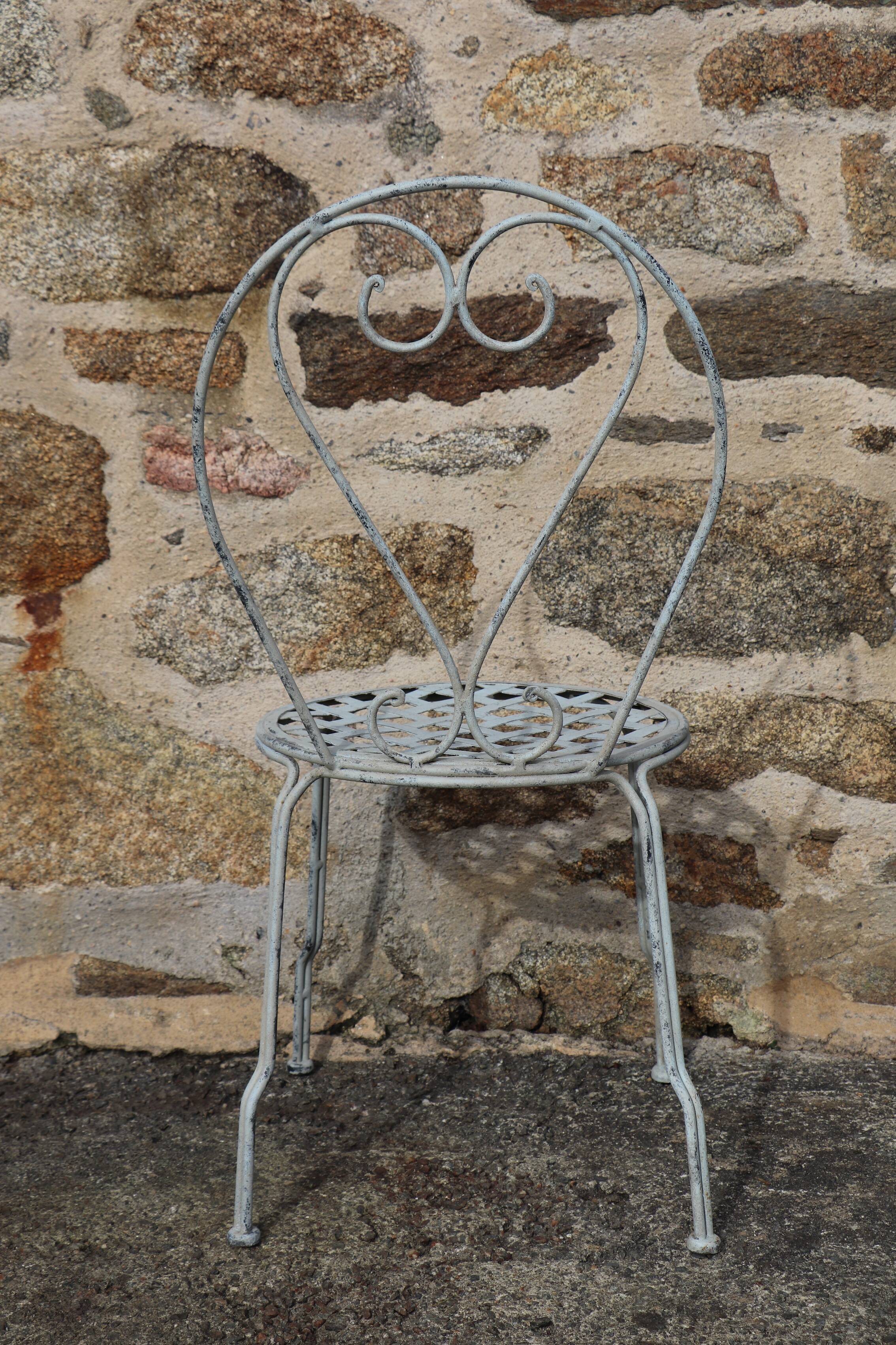 Series of 6 wrought iron garden chairs