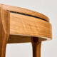 Coffee table in walnut with a ceramic top.