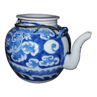 Teapot in white porcelain and blue Asian art