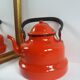 Red enamelled kettle