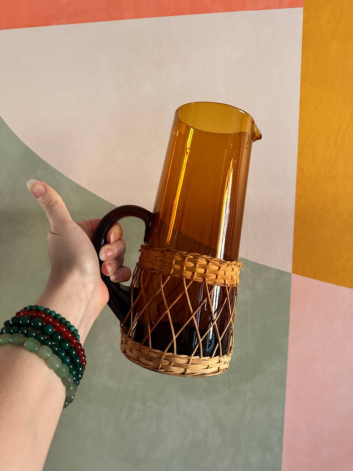 Vintage orange and wicker carafe