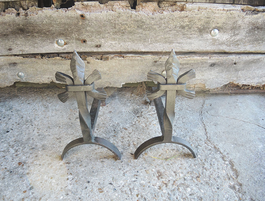Old chenets fleur de lys in wrought iron