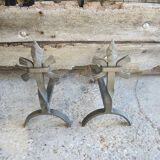Old chenets fleur de lys in wrought iron