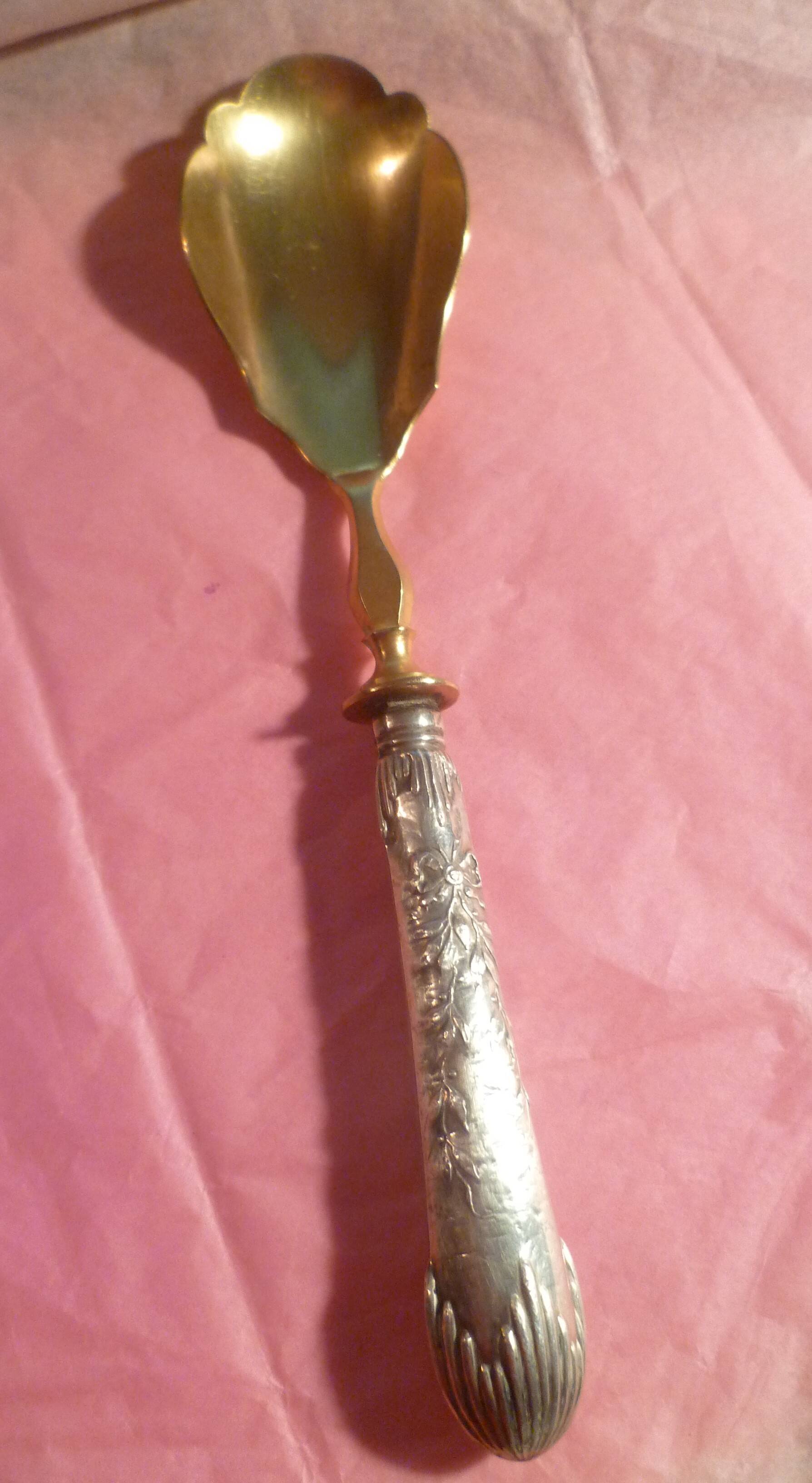 SILVER DESSERT SPOON, hallmarked ? chiseling on the spoon