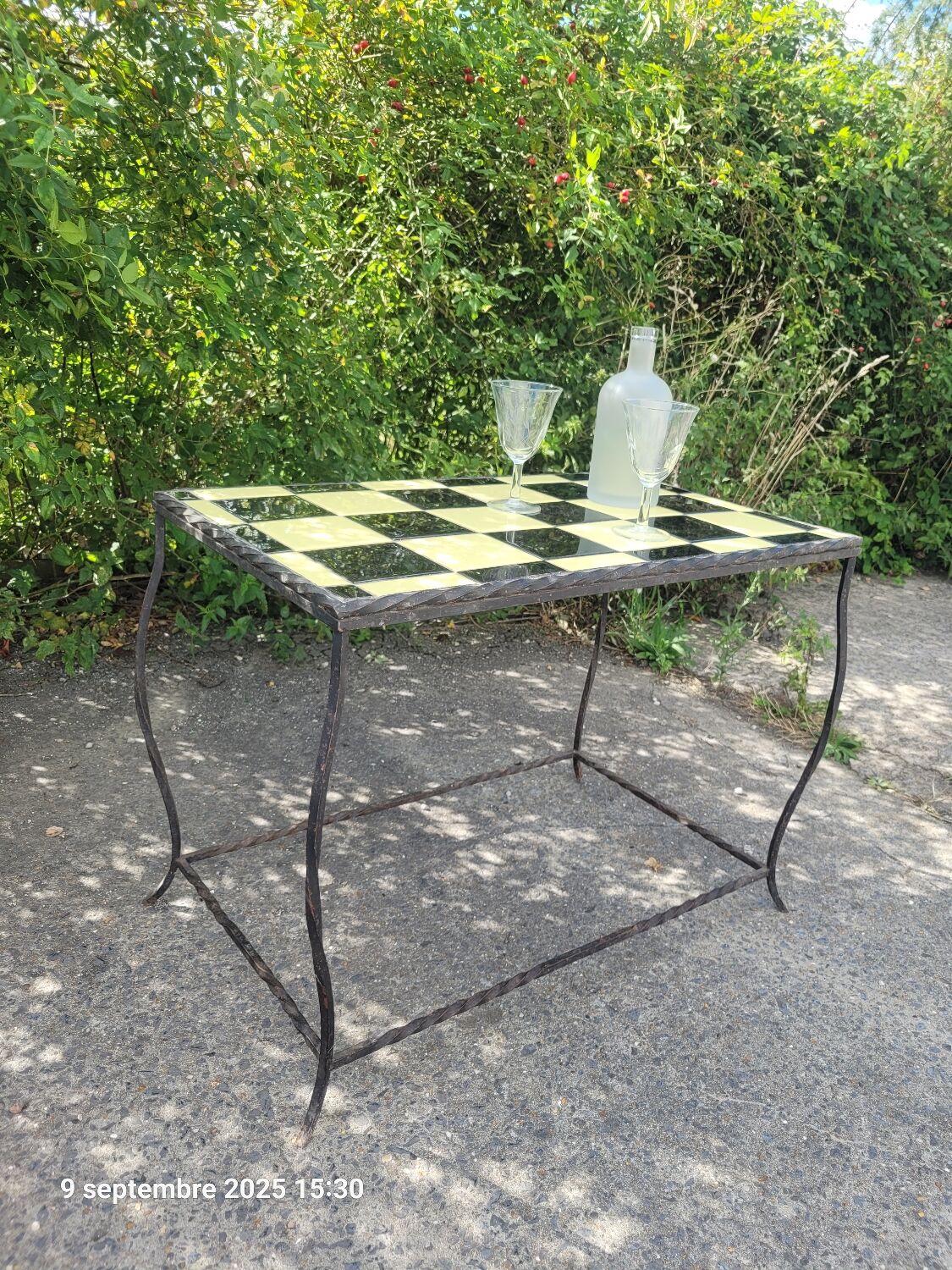 Coffee table with tiled and wrought iron finish