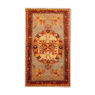 Handwoven orange wool area rug 85x155cm