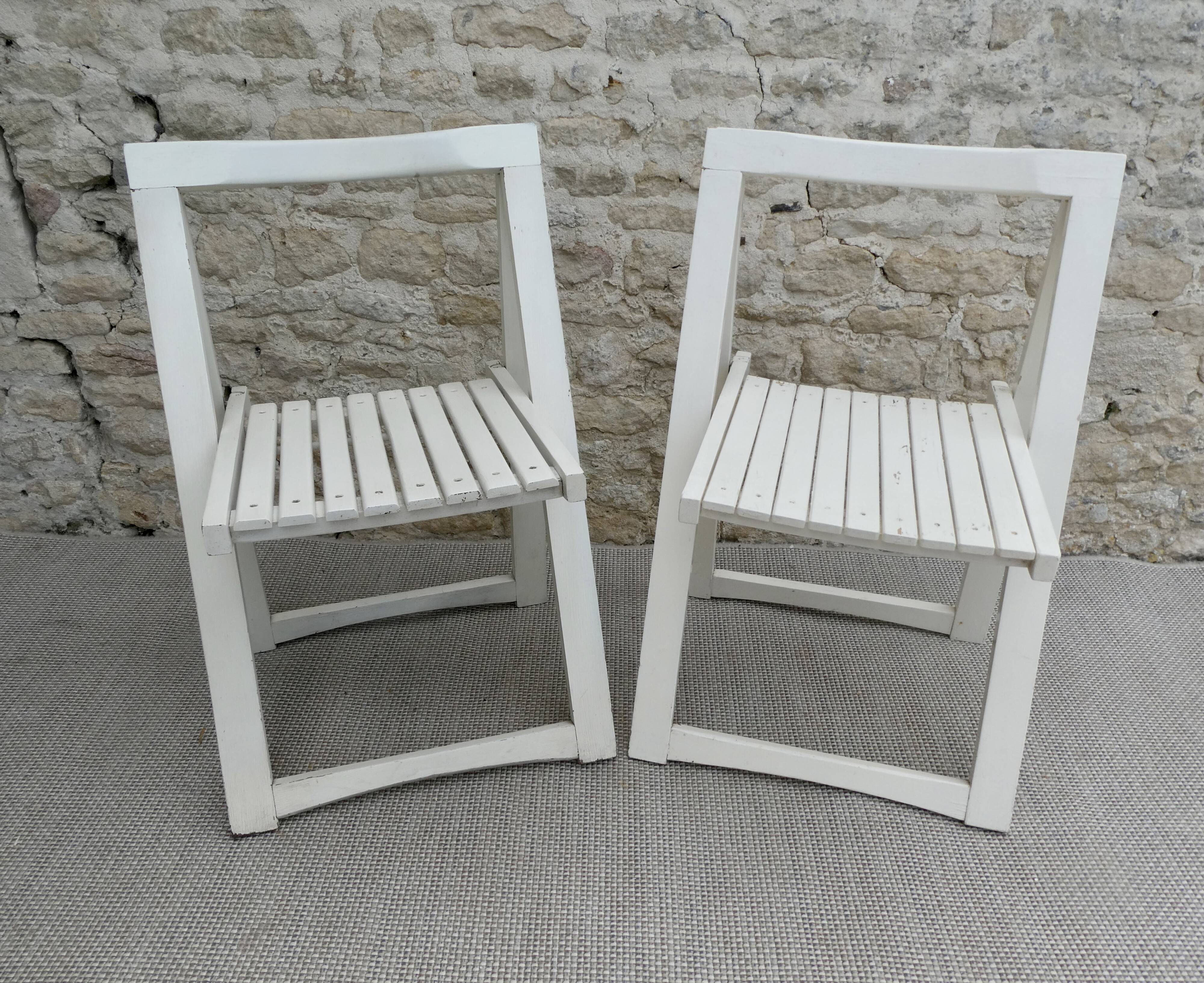 Pair of folding wooden chairs, white patina, circa 1960.