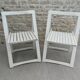 Pair of folding wooden chairs, white patina, circa 1960.