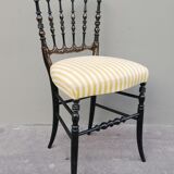Napoleon III chair late 19th in blackened wood with gilded patterns