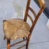 4 mismatched wood and straw chairs