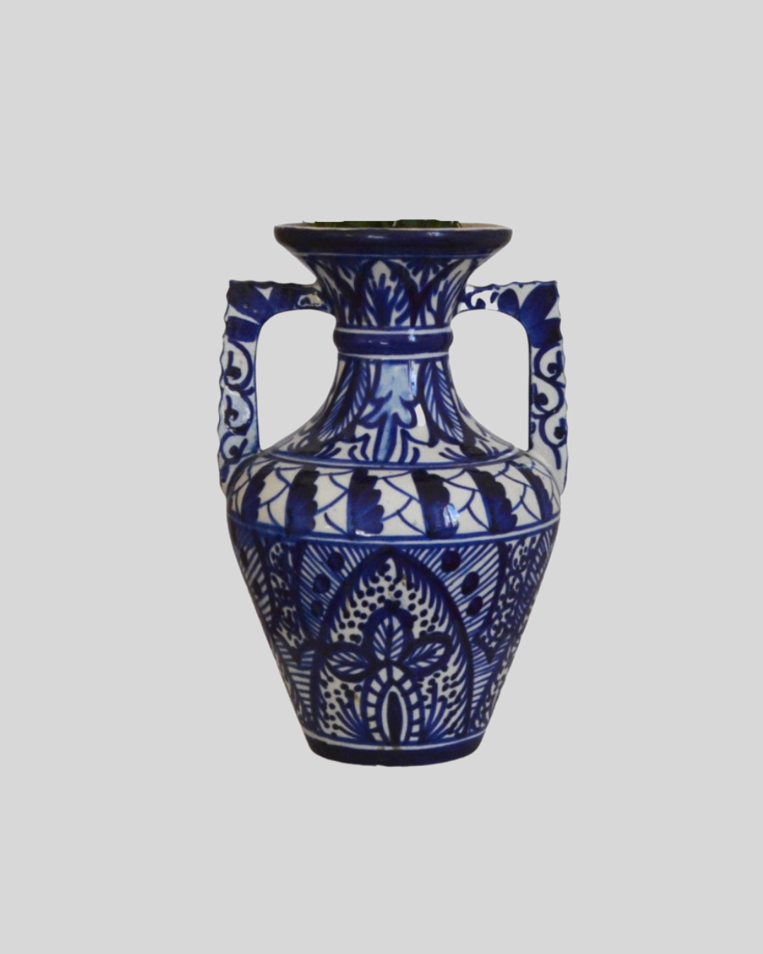 White hand-painted ceramic vase with blue patterns