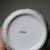 Antique cache-pot in Limoges porcelain with a relief decoration of foliage.