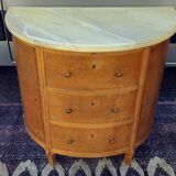 Half-moon commode in burl wood with a marble top.