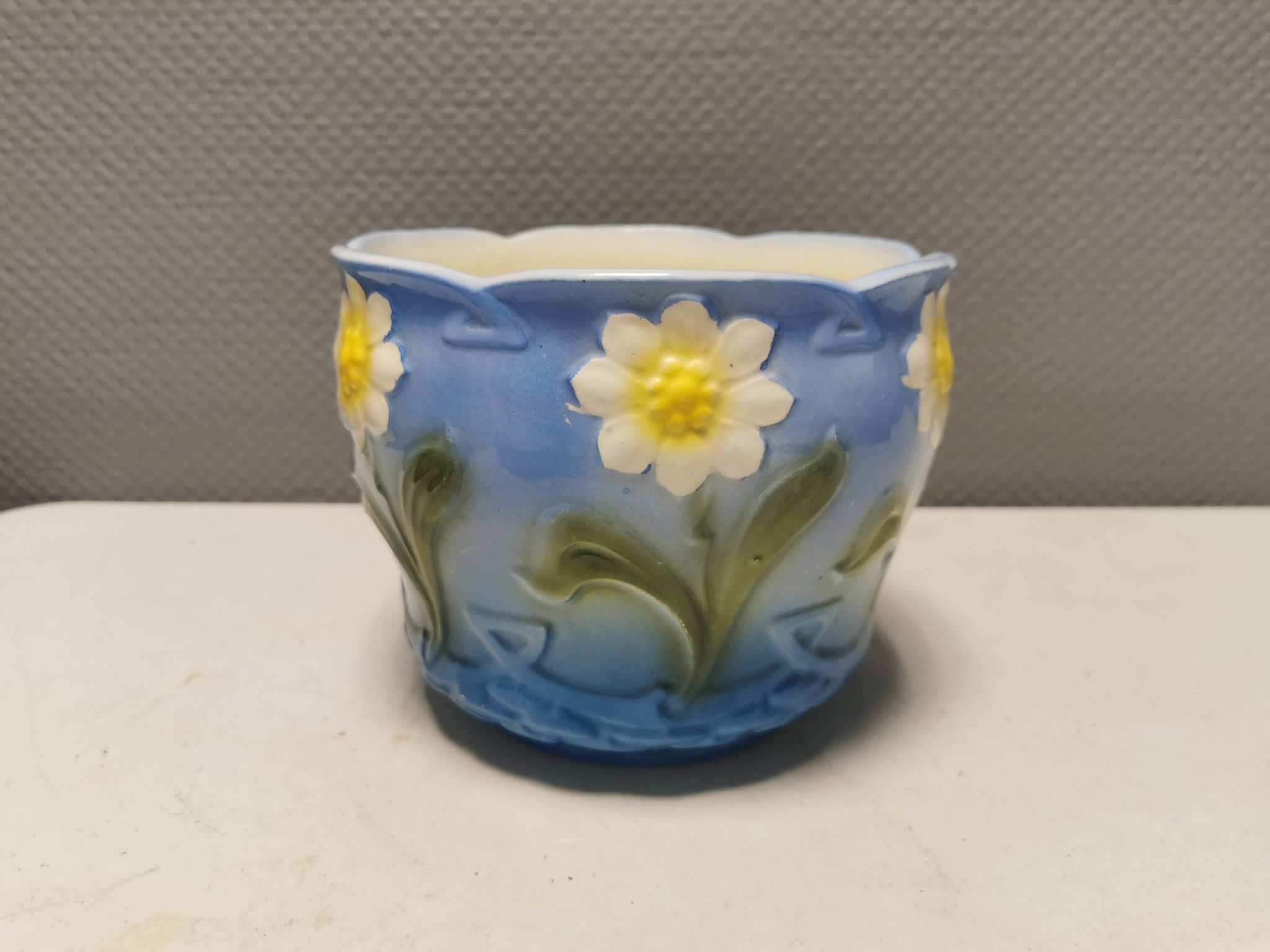 Very beautiful flower pot in soft blue and white color with floral motifs.