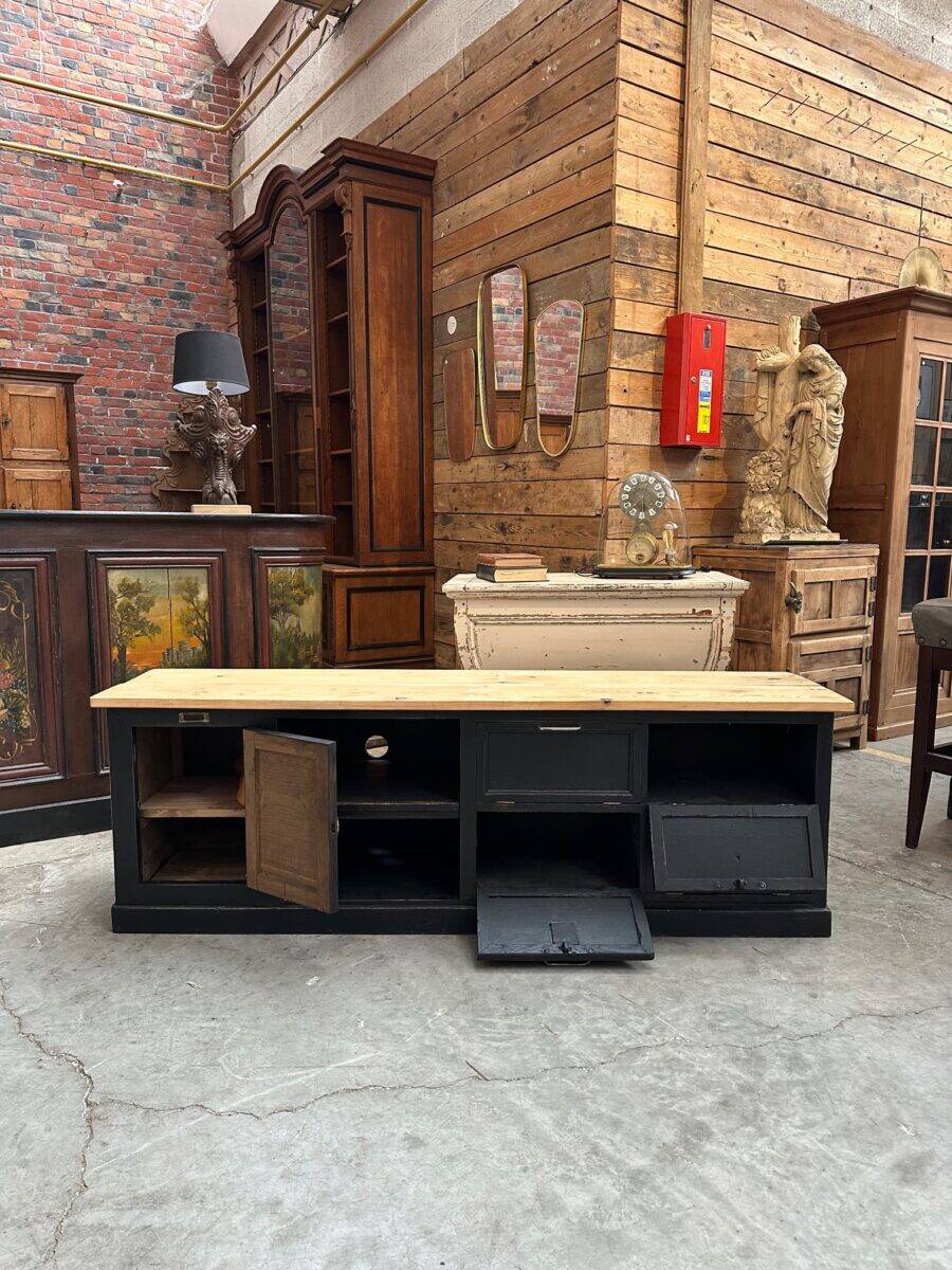Old workshop furniture transformed into a TV unit.