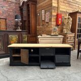 Old workshop furniture transformed into a TV unit.