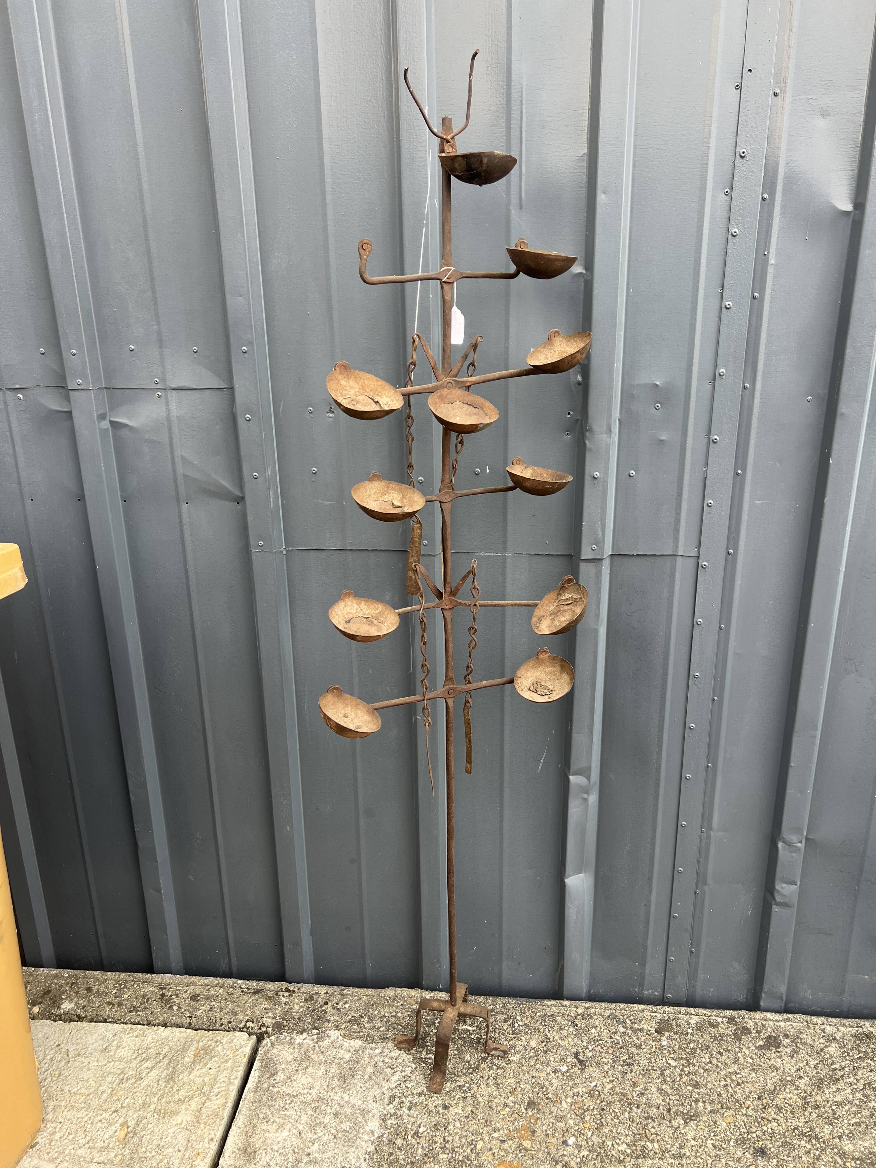 African oil lamps on stands