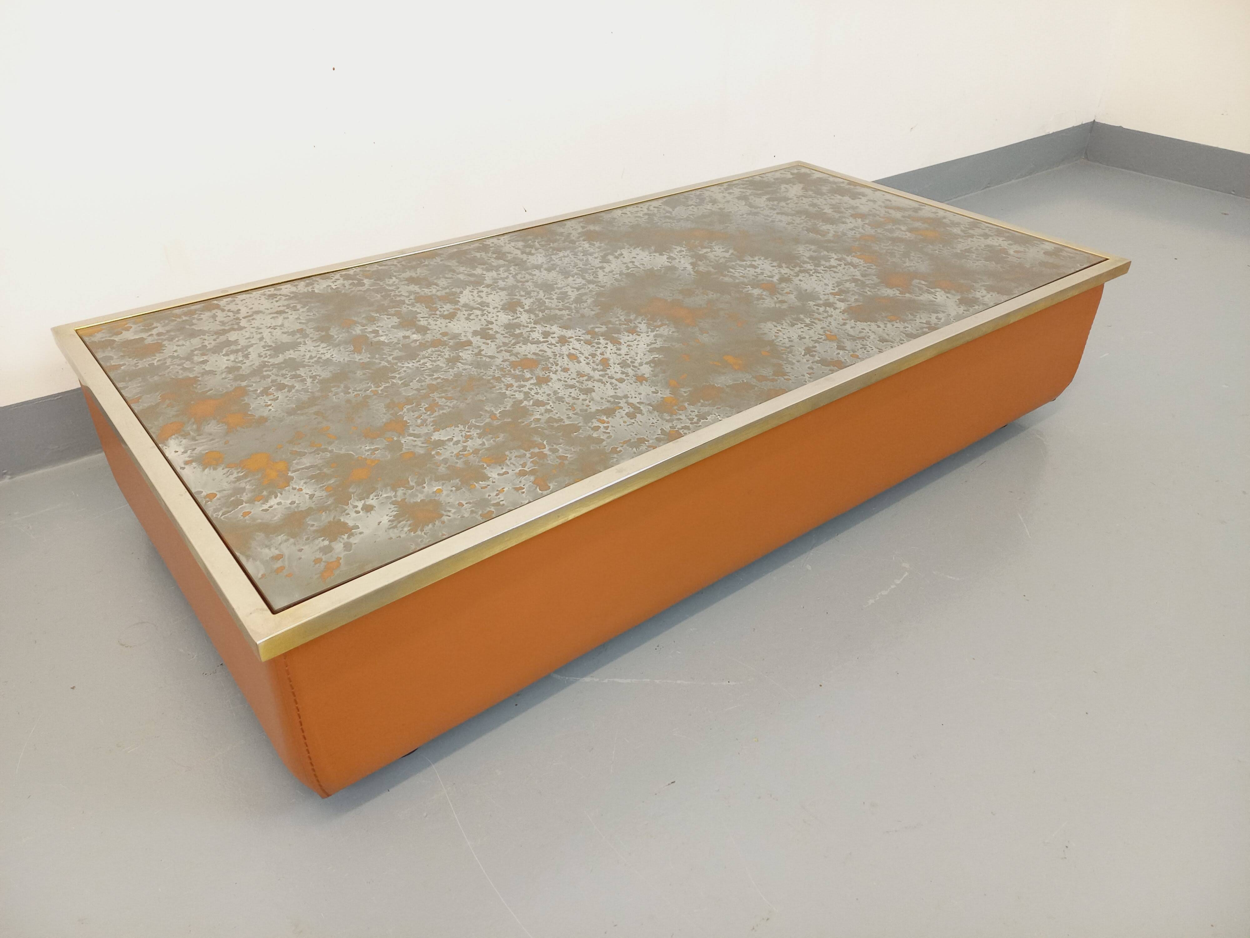 Vintage coffee table in églomisé glass, chrome and leather from the 70s