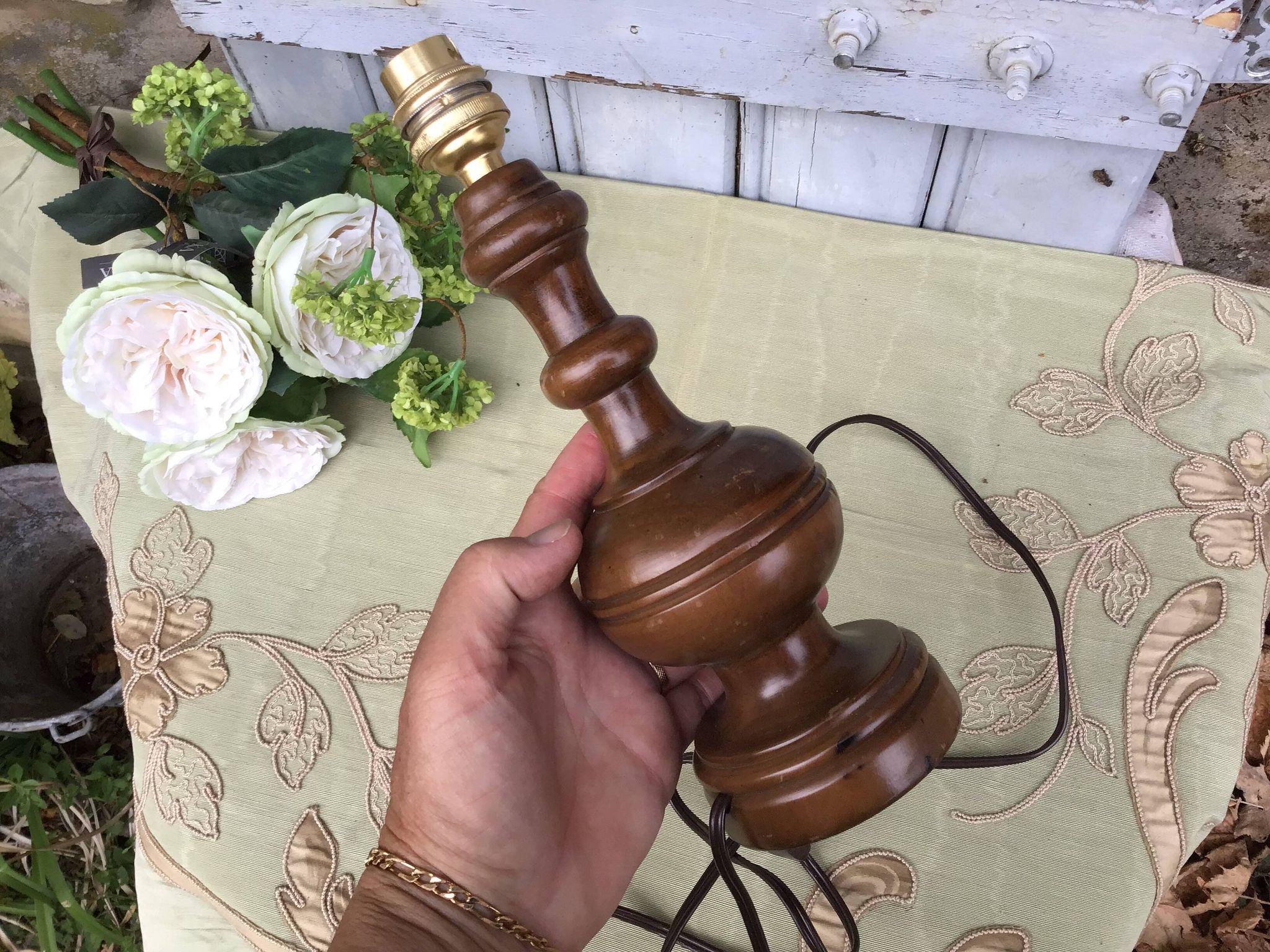 Turned wooden foot lamp with pleated lampshade