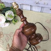 Turned wooden foot lamp with pleated lampshade