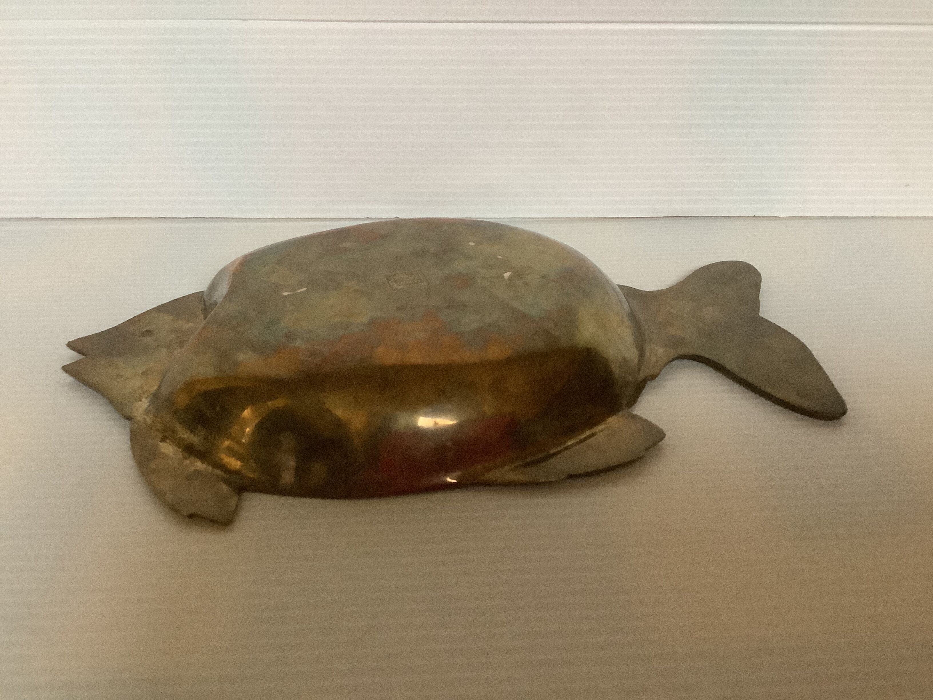 Empty brass fish bag