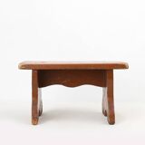 French rustic low church stool in terracotta painted wood, ca. 1900