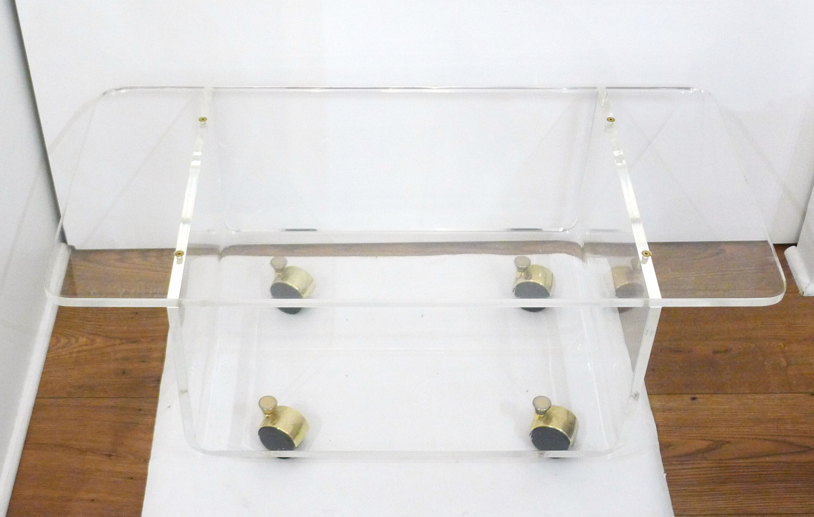 Transparent thermoformed plexi coffee table, on wheels
