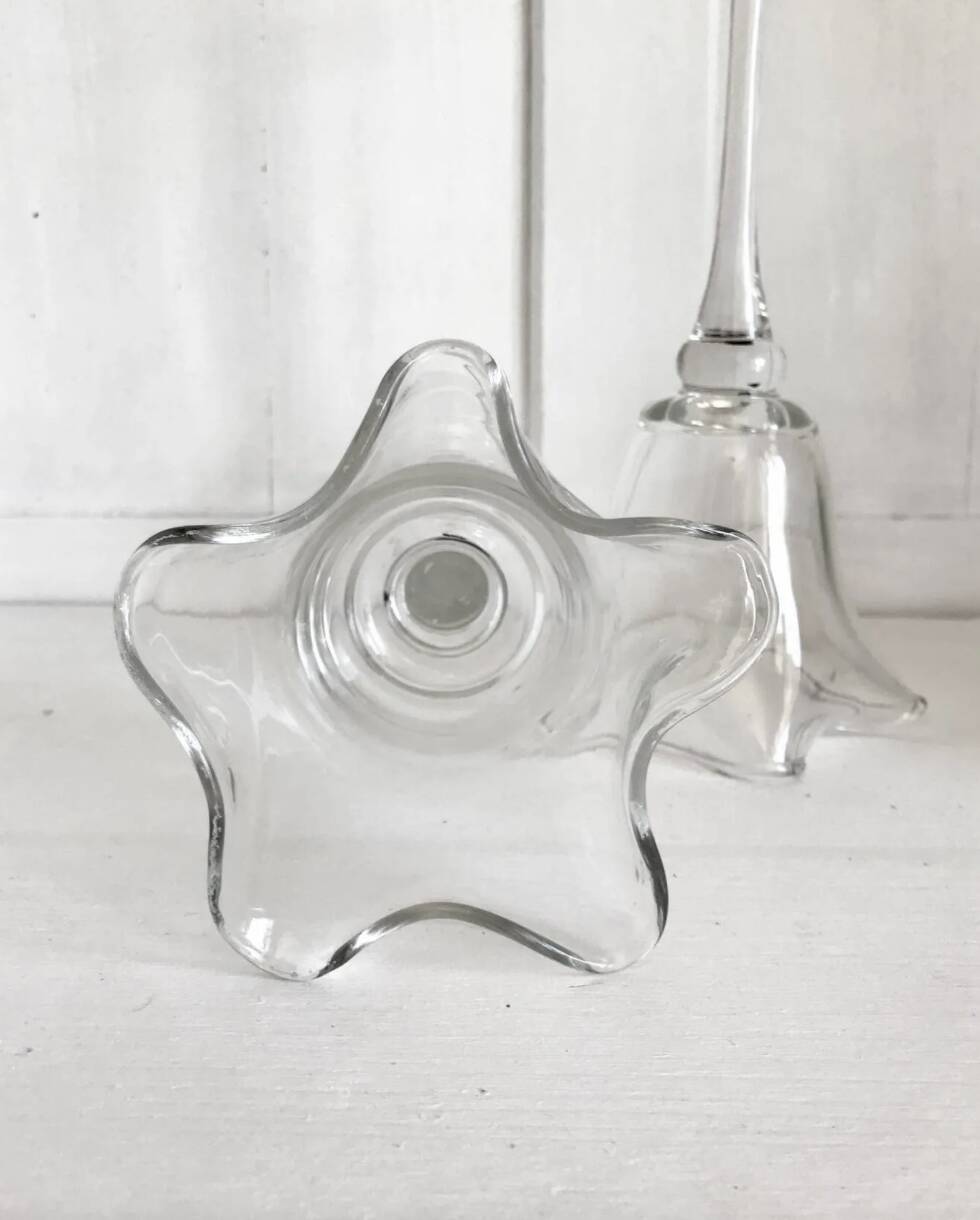 Pair of glass candlesticks on a stand