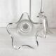 Pair of glass candlesticks on a stand