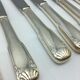 12 silver metal knives.