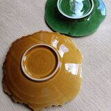Two earthenware plates, a vine leaf and a cabbage slip