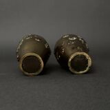 Pair of Japanese vases in chiselled bronze with inlaid bird decoration.