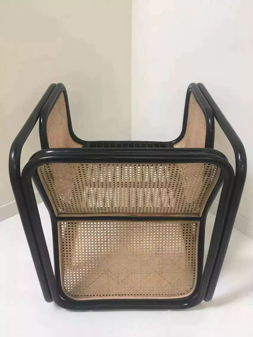 Armchair in black lacquered rattan and natural cane