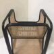 Fauteuil en rotin laqué noir et cannage naturel