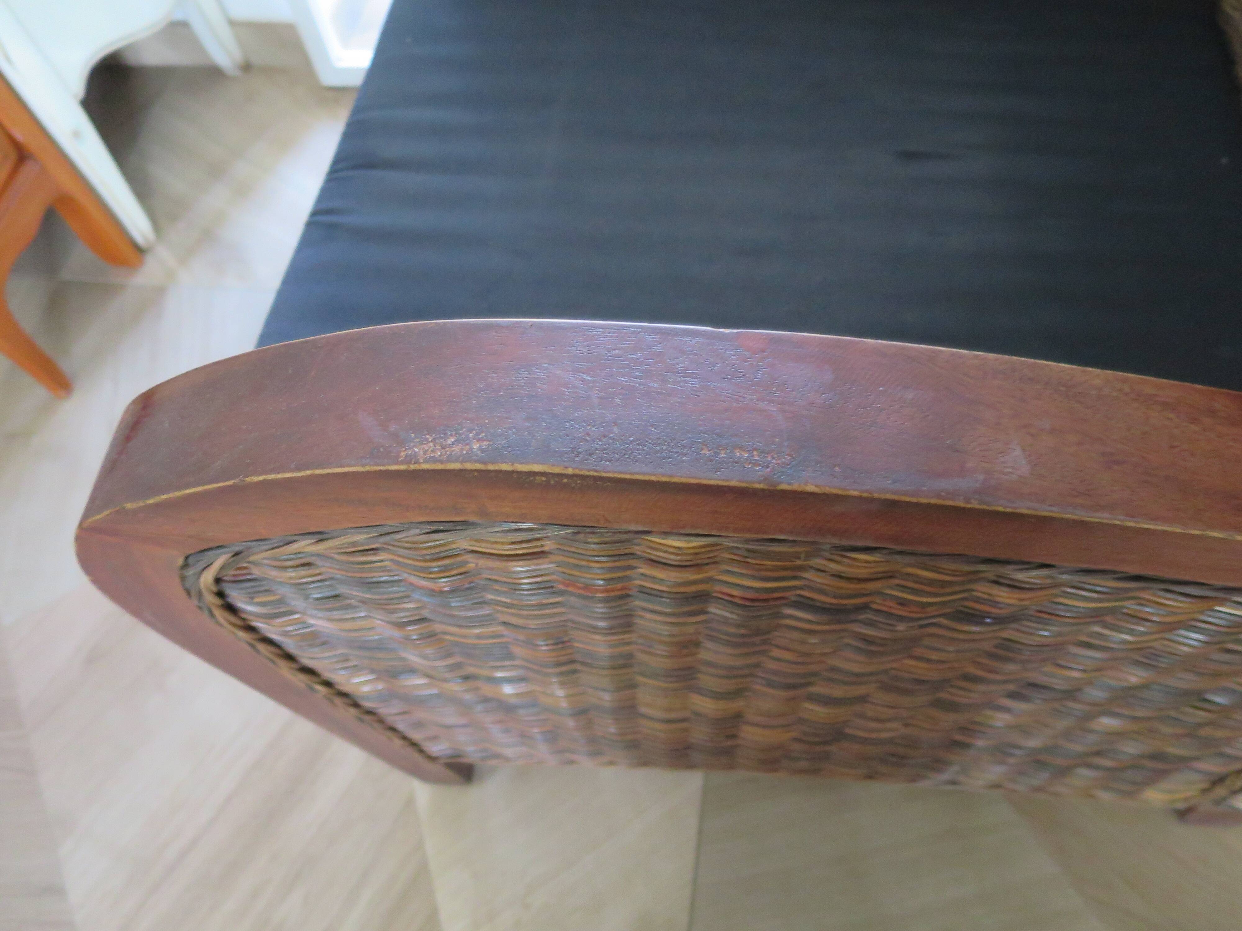 2 colonial-style armchairs in woven rattan and exotic wood