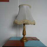 Lamp with brass foot and fringed lampshade