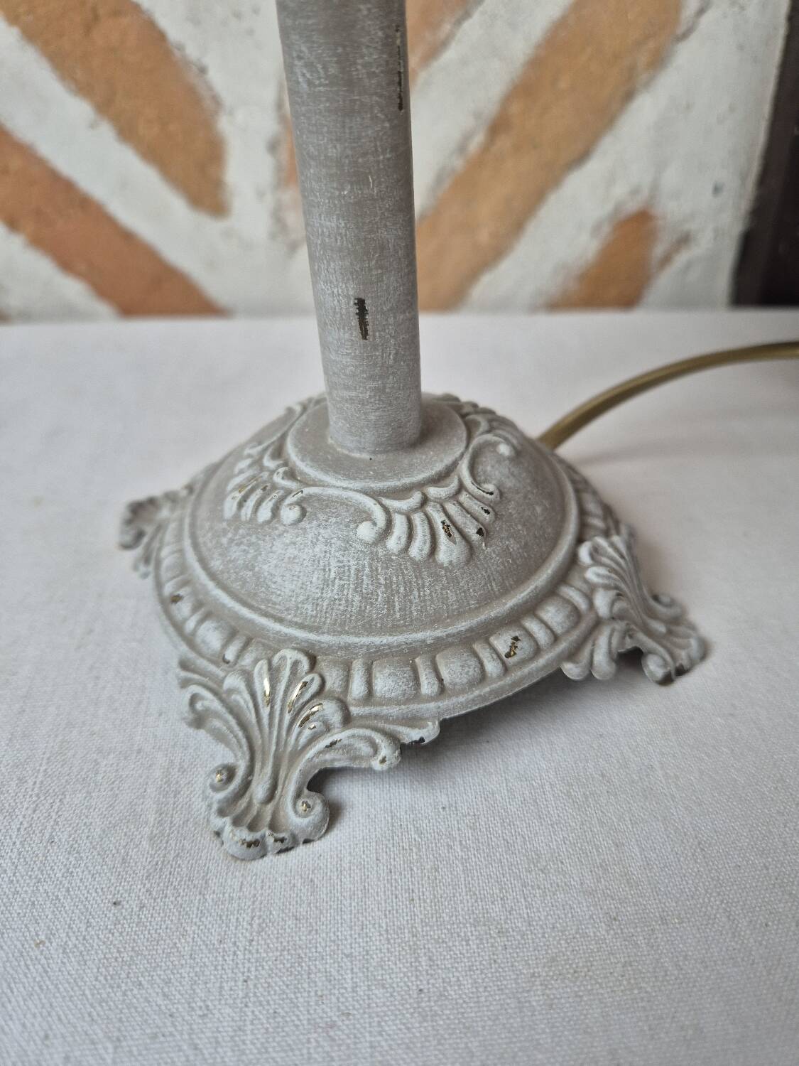 Patinated taupe bedside lamp