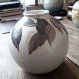 Vintage vase with plant decoration