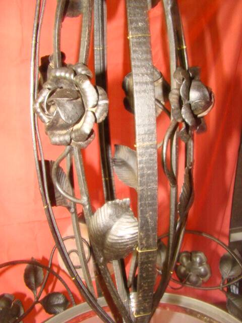 four-armed wrought iron chandelier from the "Art Deco" period (1925)