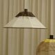 Woven bell suspension on metal structure.