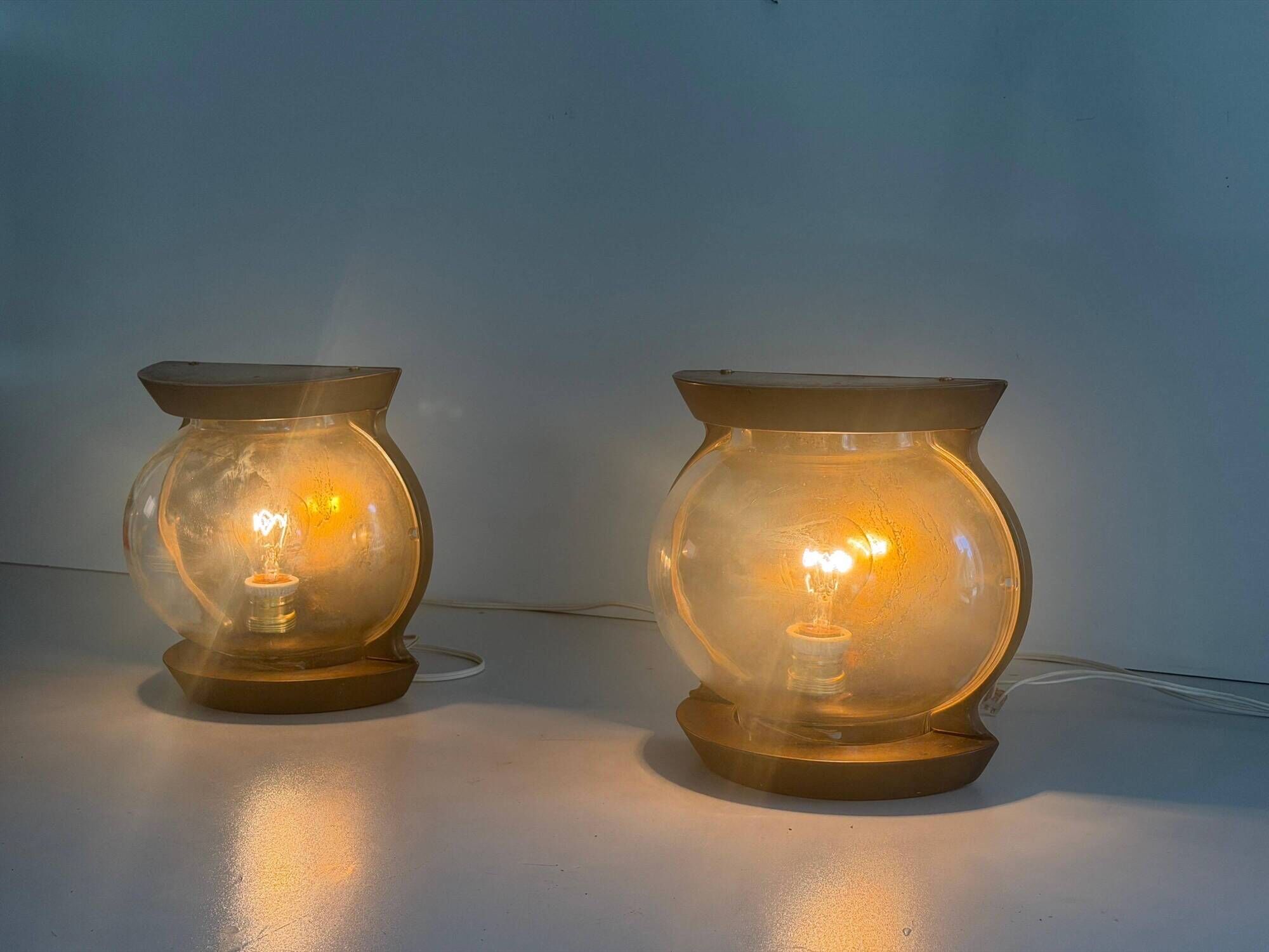 Pair of bronze and glass wall lights from the mid-century, 1960, Italy.